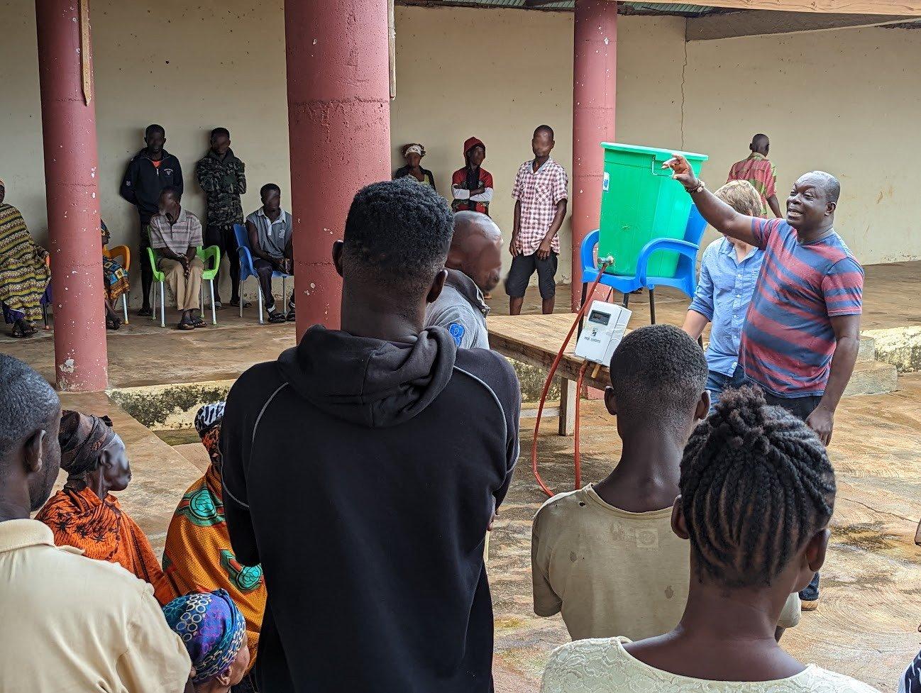 A Maji Systems team member on a field visit to a community water point