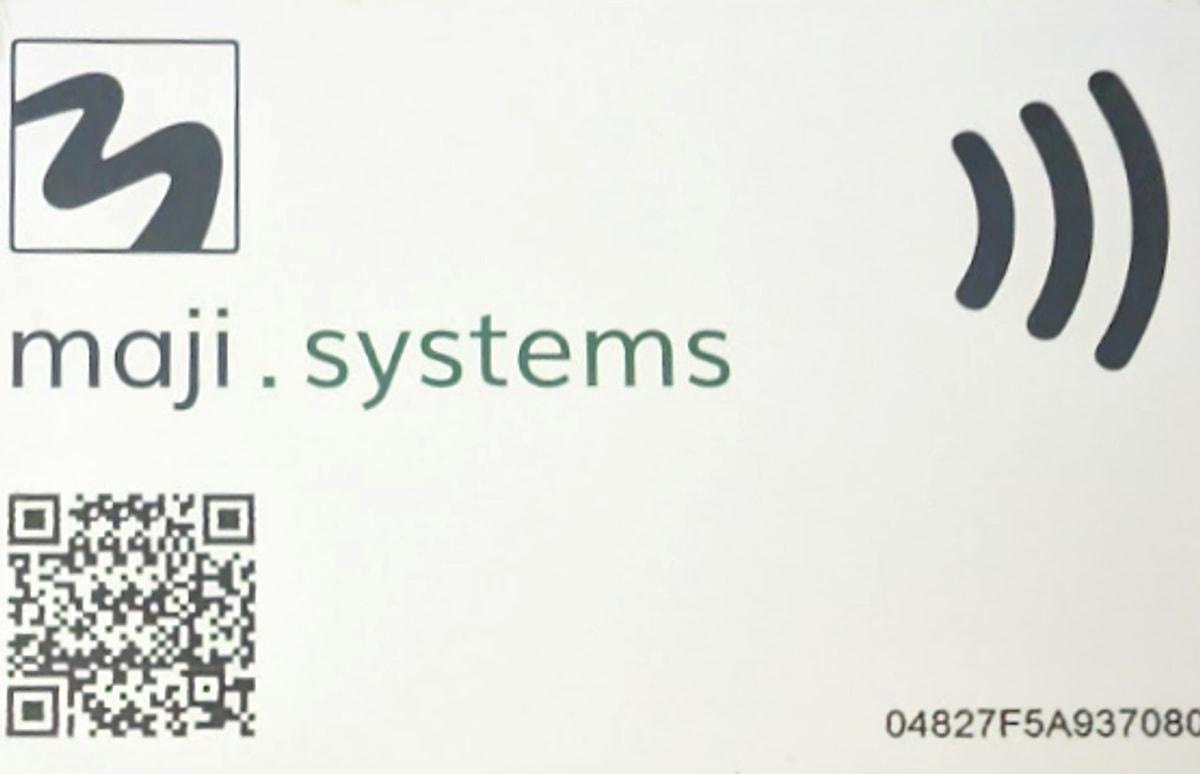 A white Maji Systems WaterCard, the prepaid NFC card customers use to buy water